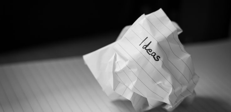 a crumpled up piece of paper with the word ideas written on it